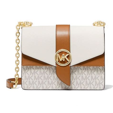 michael kors acorn vs luggage|Michael Kors clutch bag.